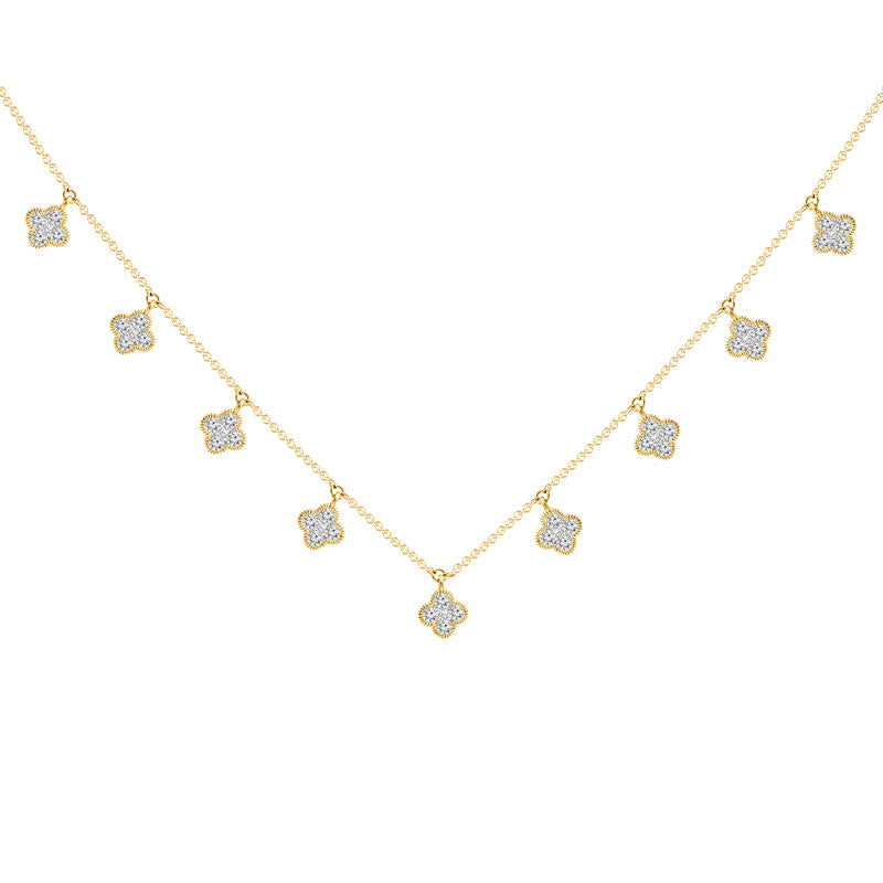 Clover design diamond necklace in yellow gold.