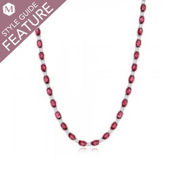 Oval ruby necklace in white gold setting.