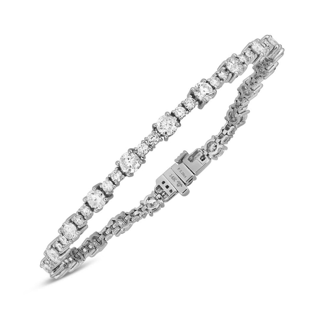 Round diamond studs, 14K white gold, classic design.