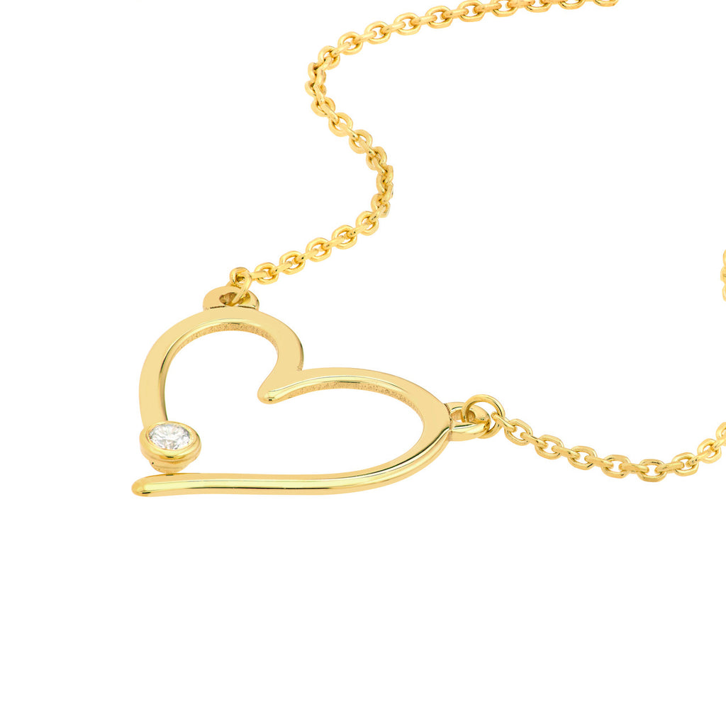 Heart-shaped gold necklace with diamond accent.