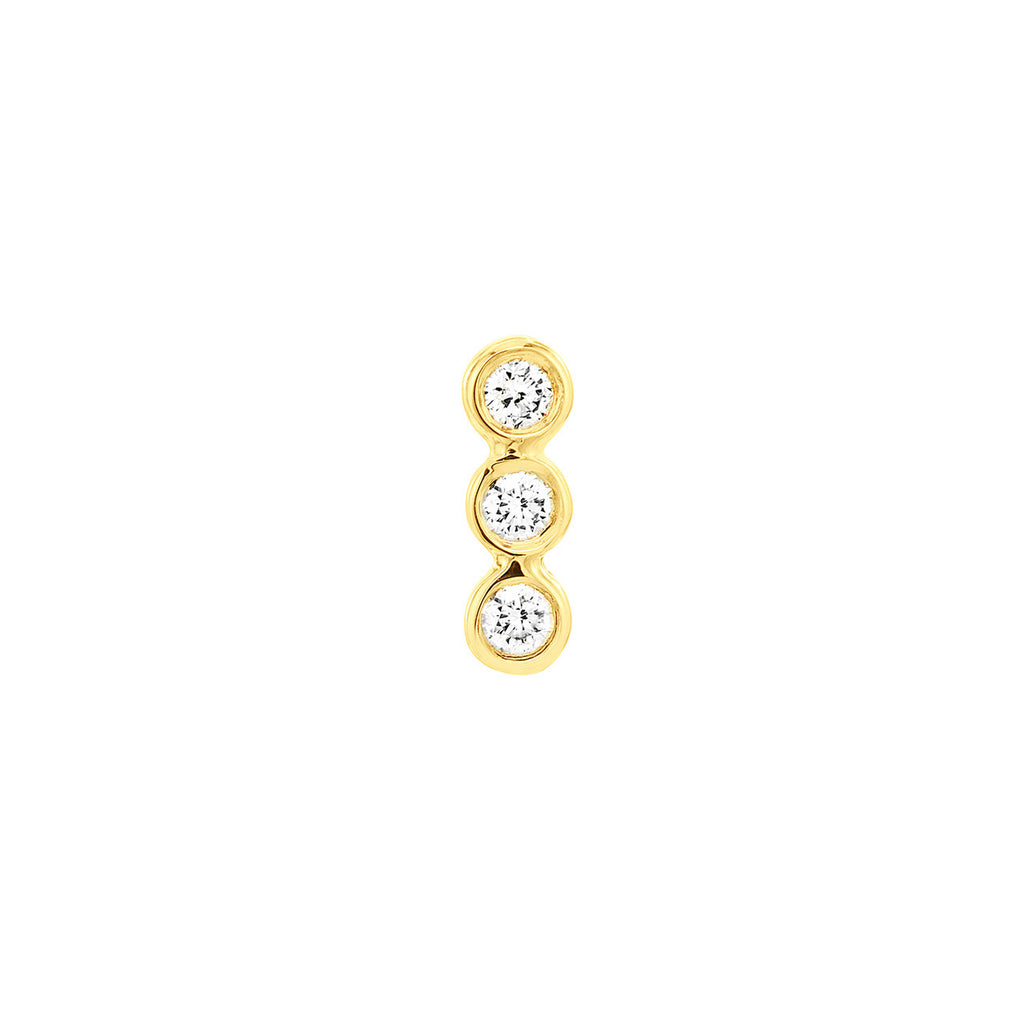 Three round diamonds in yellow gold setting.