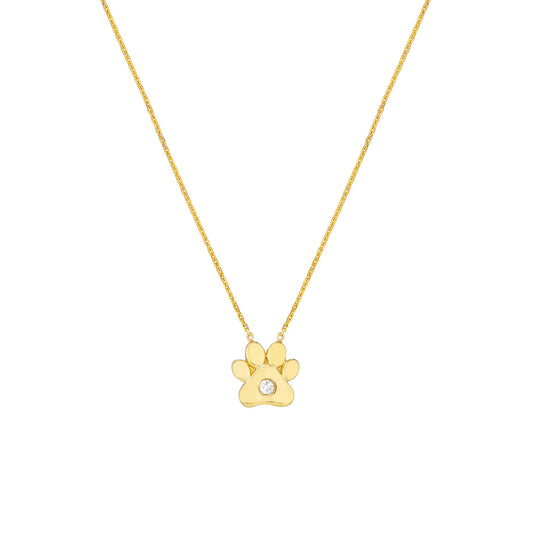 Paw-shaped gold necklace with central diamond.