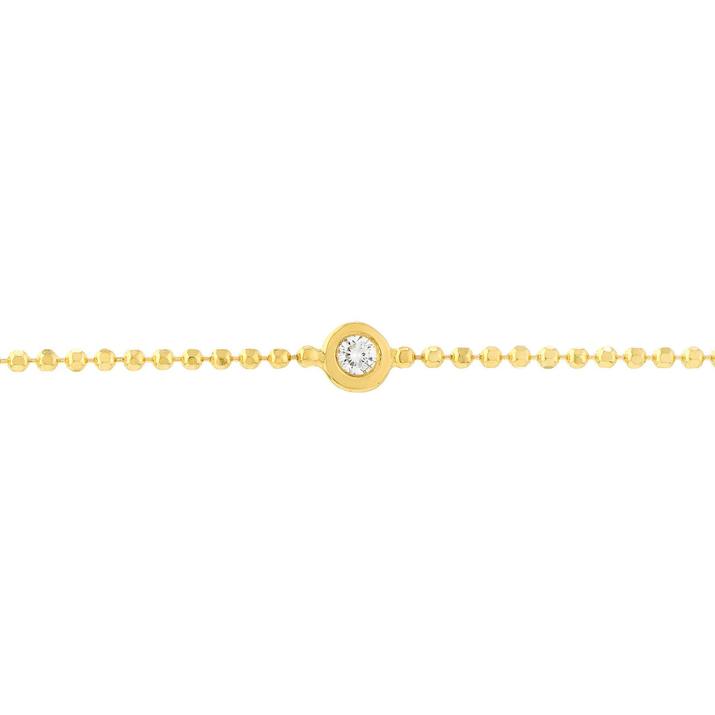 Yellow gold bracelet with round diamond accent.
