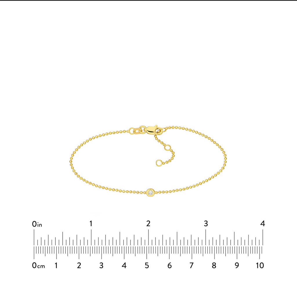 Yellow gold bracelet with small round diamond.