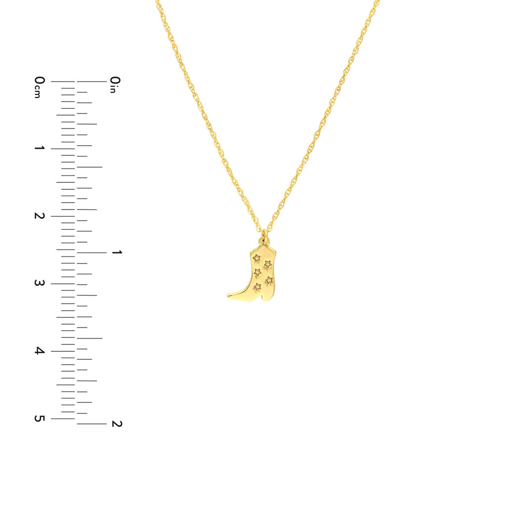 Yellow gold boot pendant with star cutouts.