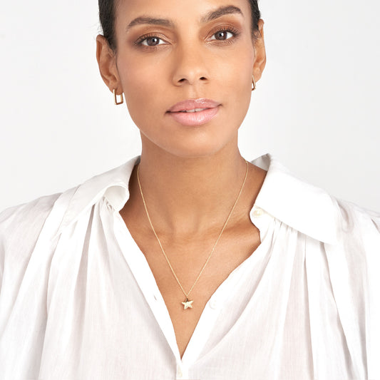 14K yellow gold star pendant necklace.
