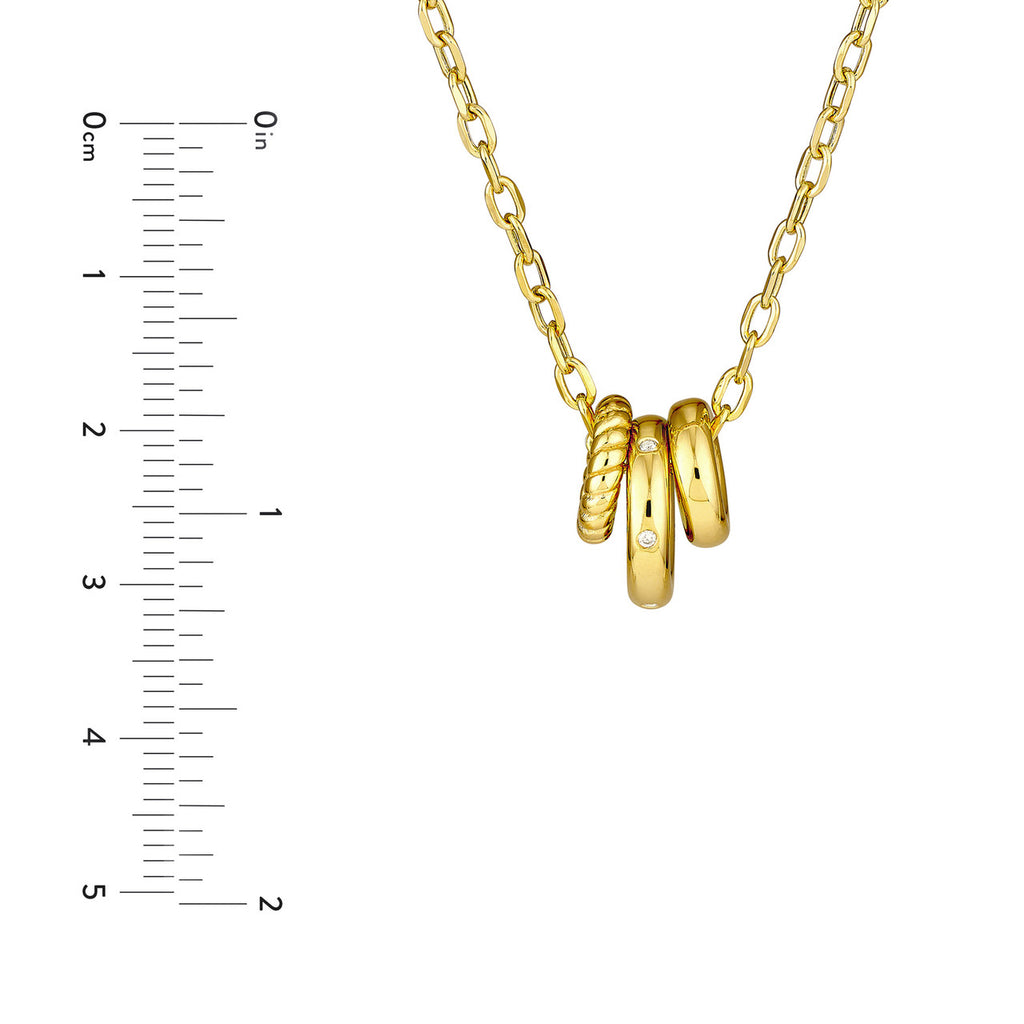 Yellow gold necklace with diamond-accented rings.