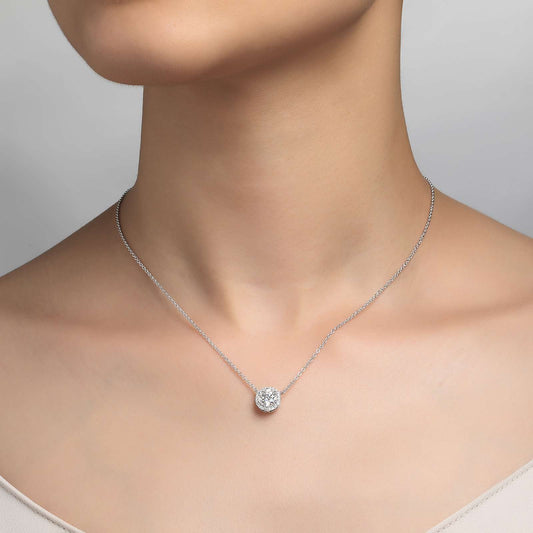 Simulated diamond pendant on silver chain.