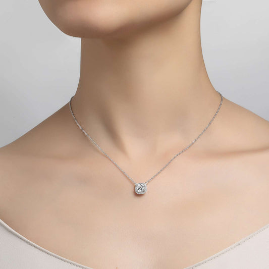 Simulated diamond pendant on silver chain.