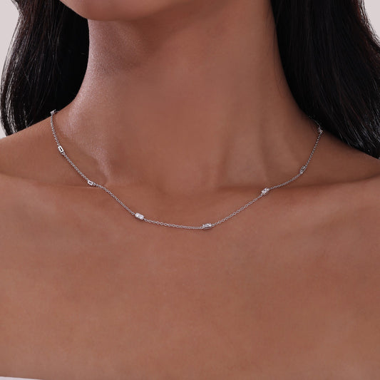 Simulated diamond necklace on woman's neck.