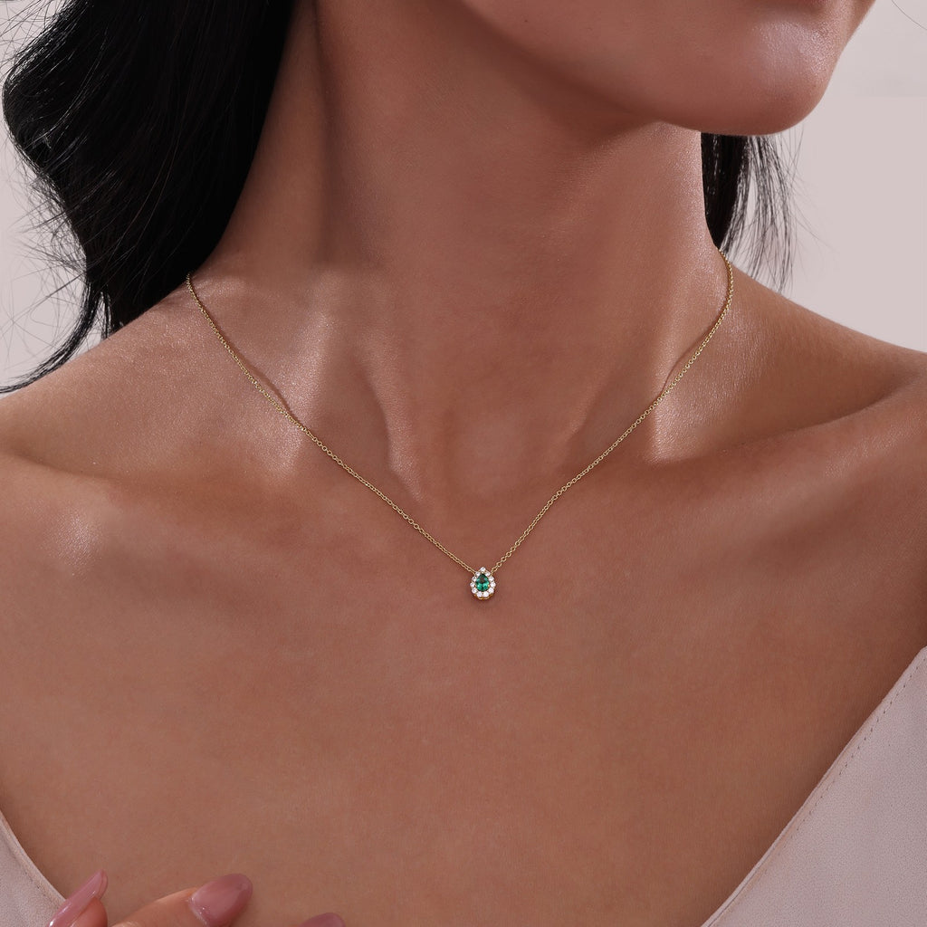 Pear-shaped emerald heart necklace.