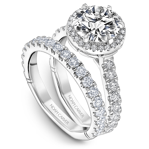 Halo diamond ring with side stones.