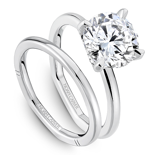 Solitaire diamond ring with hidden accents.