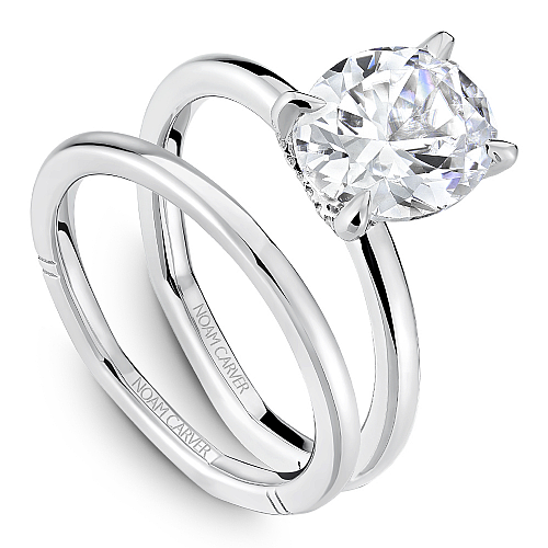 14K white gold solitaire diamond ring.