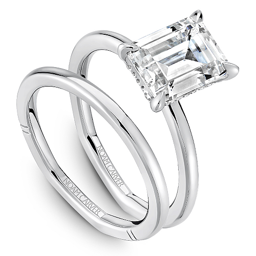 Solitaire diamond ring with hidden accents.