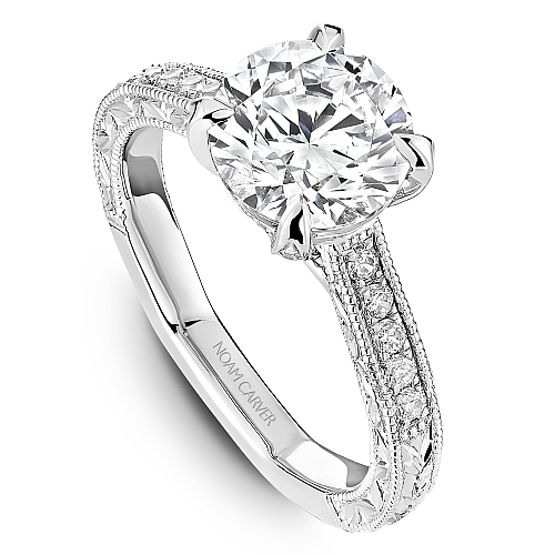 Solitaire diamond ring with accent stones.