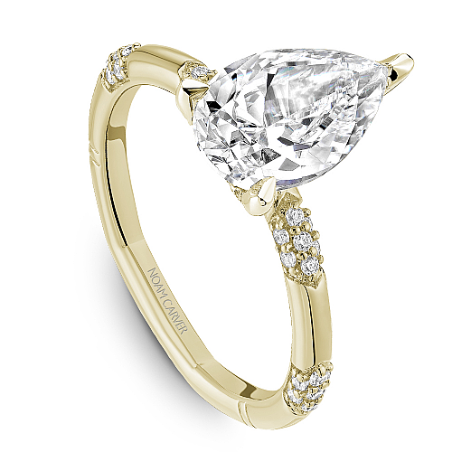 Yellow gold ring with pear-shaped diamond.