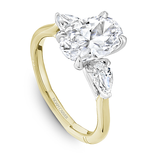 14K gold ring with pear-shaped diamonds.