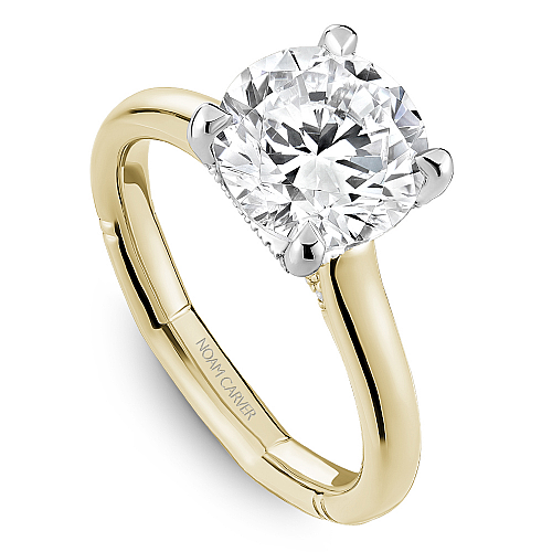 Two-tone diamond engagement ring with accents.