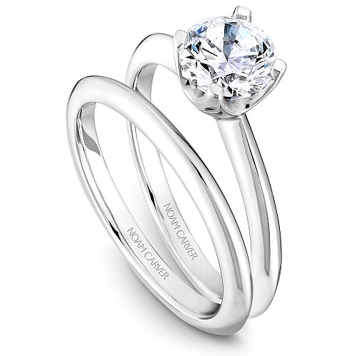 14K white gold solitaire engagement ring.