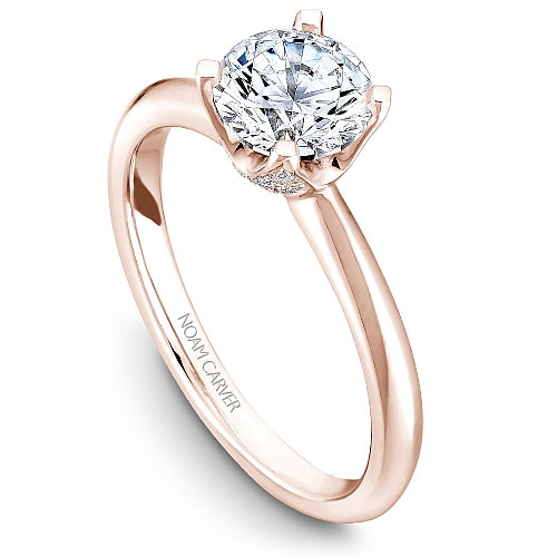 Rose gold engagement ring with hidden diamond accents.