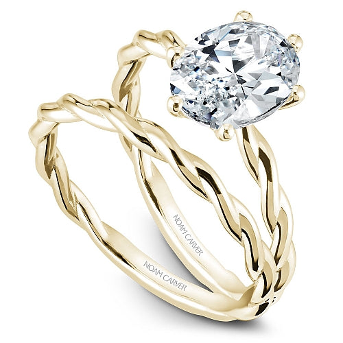 Braided yellow gold ring with diamond setting.