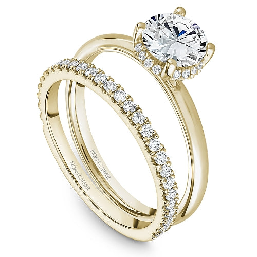 Yellow gold diamond semi-mount engagement ring.
