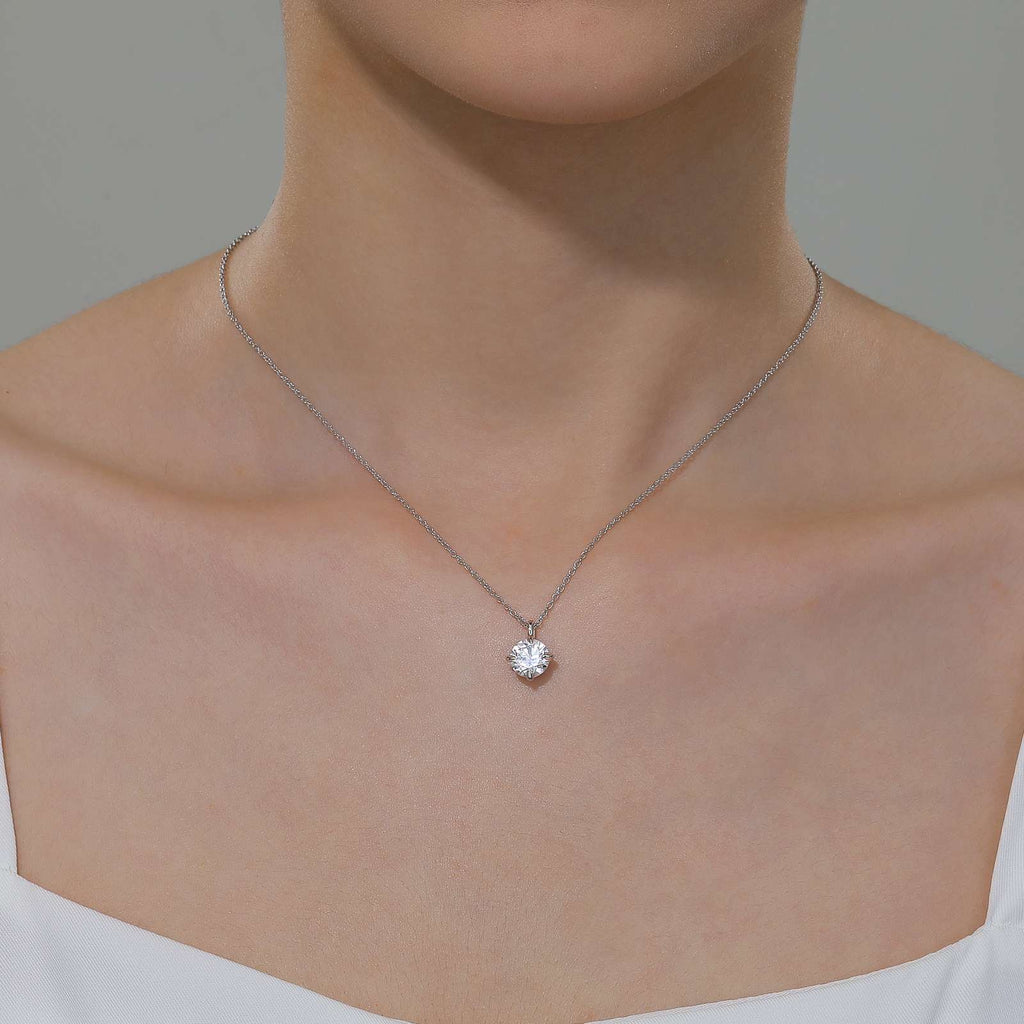 Simulated diamond pendant on silver chain.