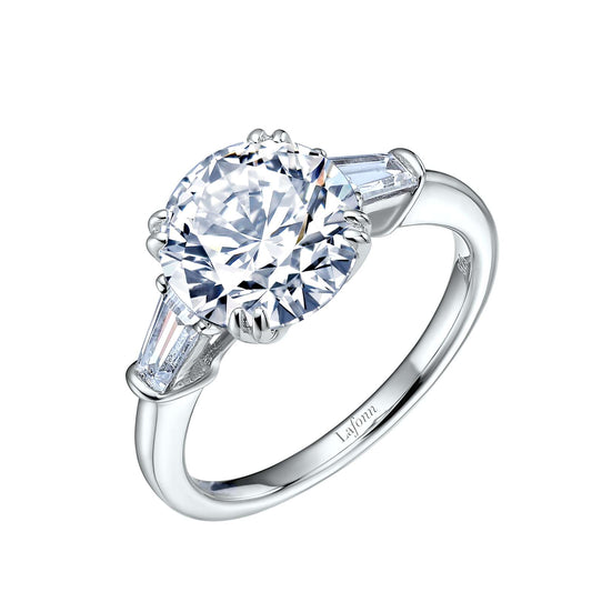 Three-stone platinum simulated diamond engagement ring.