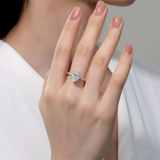 Oval diamond ring on hand.