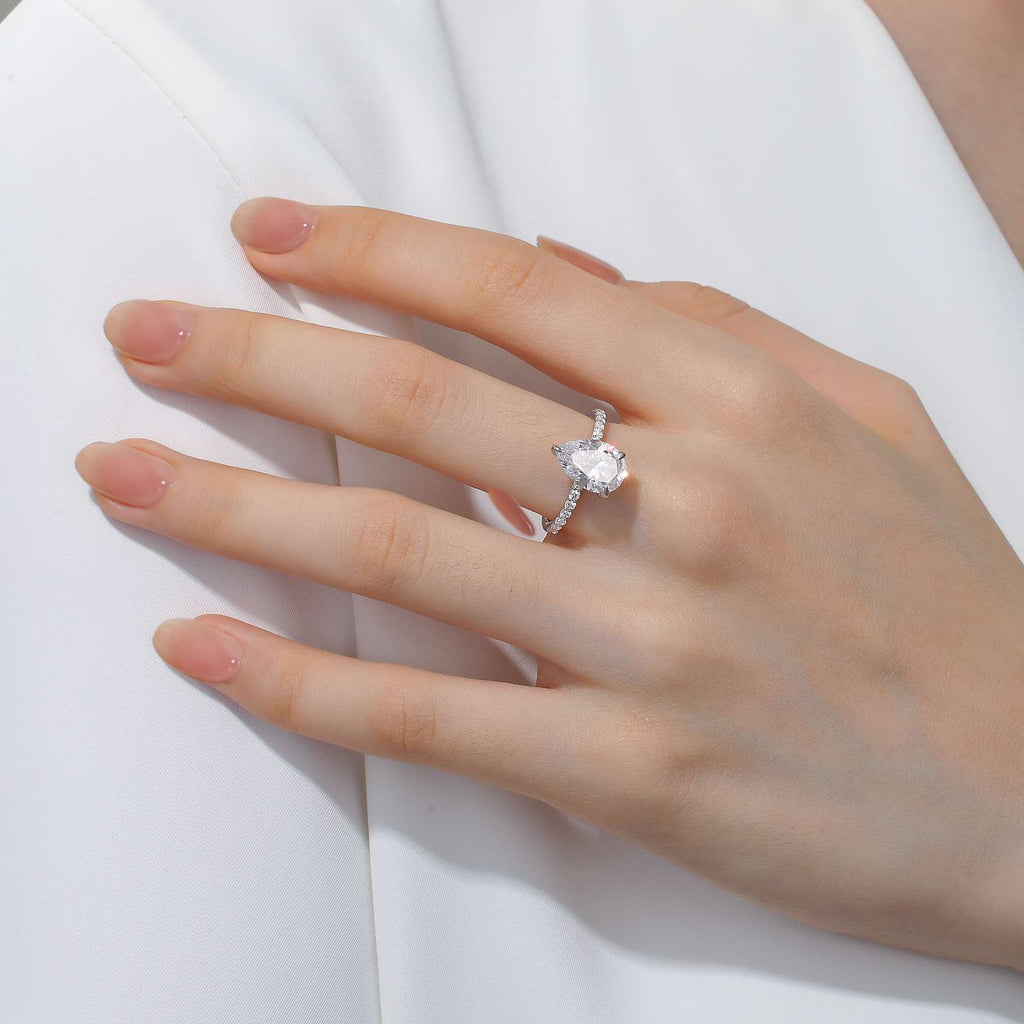 Platinum ring with pear-shaped simulated diamonds.