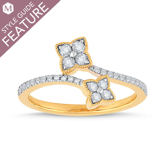 Yellow gold ring with floral diamond clusters.