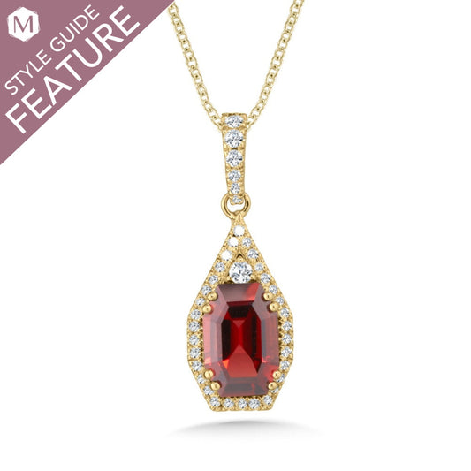 Garnet pendant with diamond accents in gold.