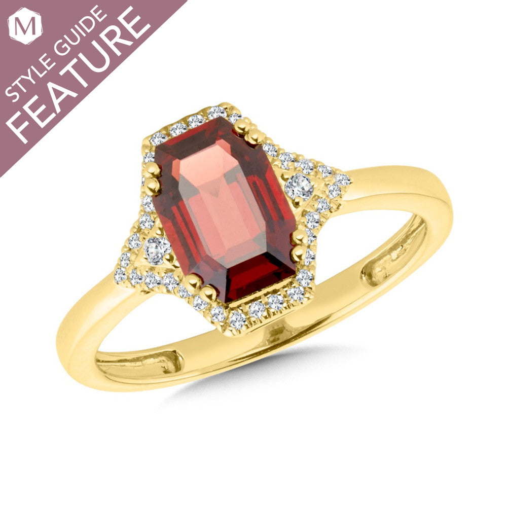 Garnet ring with diamond accents in gold.