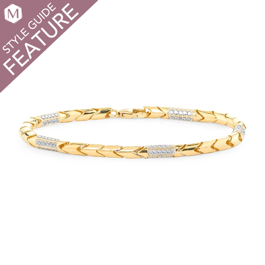 Yellow gold bracelet with diamond accents.