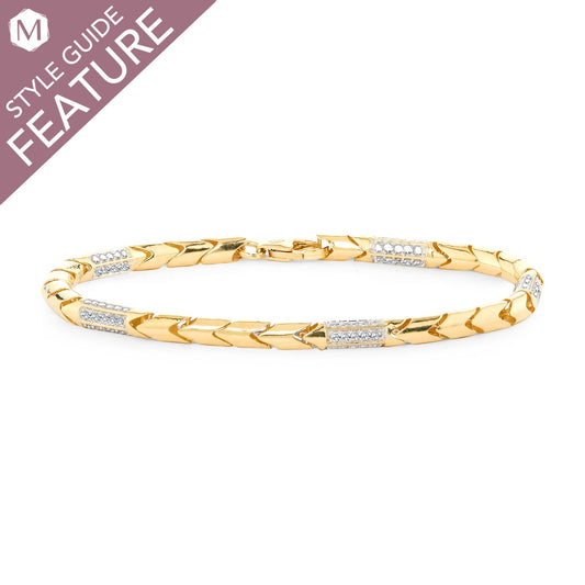 Yellow gold bracelet with diamond accents.