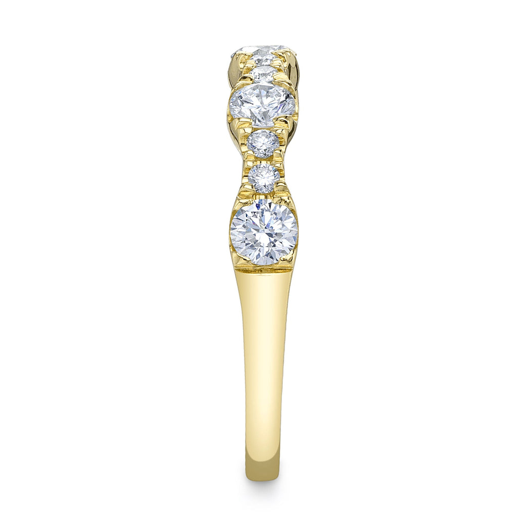 Yellow gold band with round diamonds.