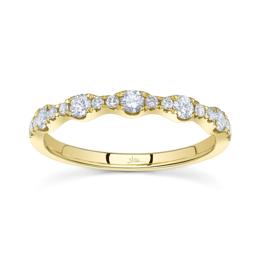 Yellow gold band with round diamonds.