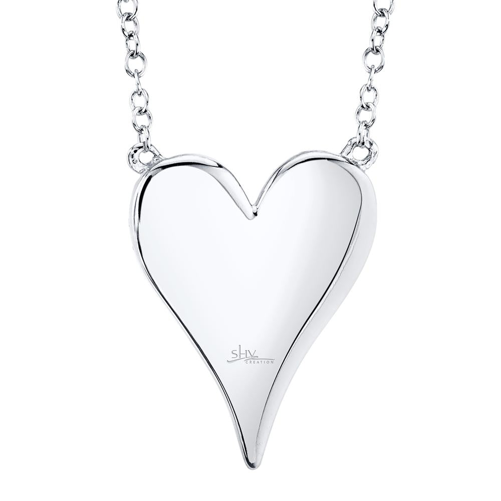 Heart-shaped white gold pendant necklace.