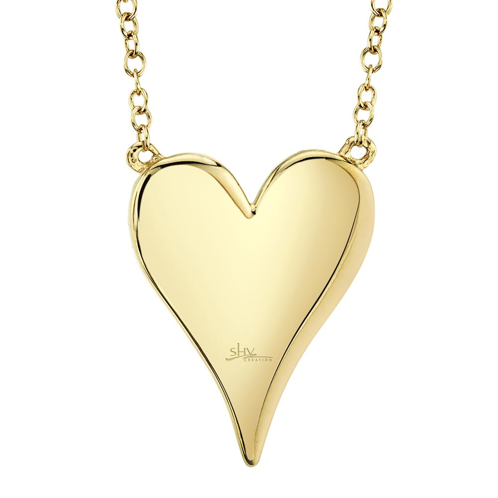 Heart-shaped yellow gold pendant necklace.