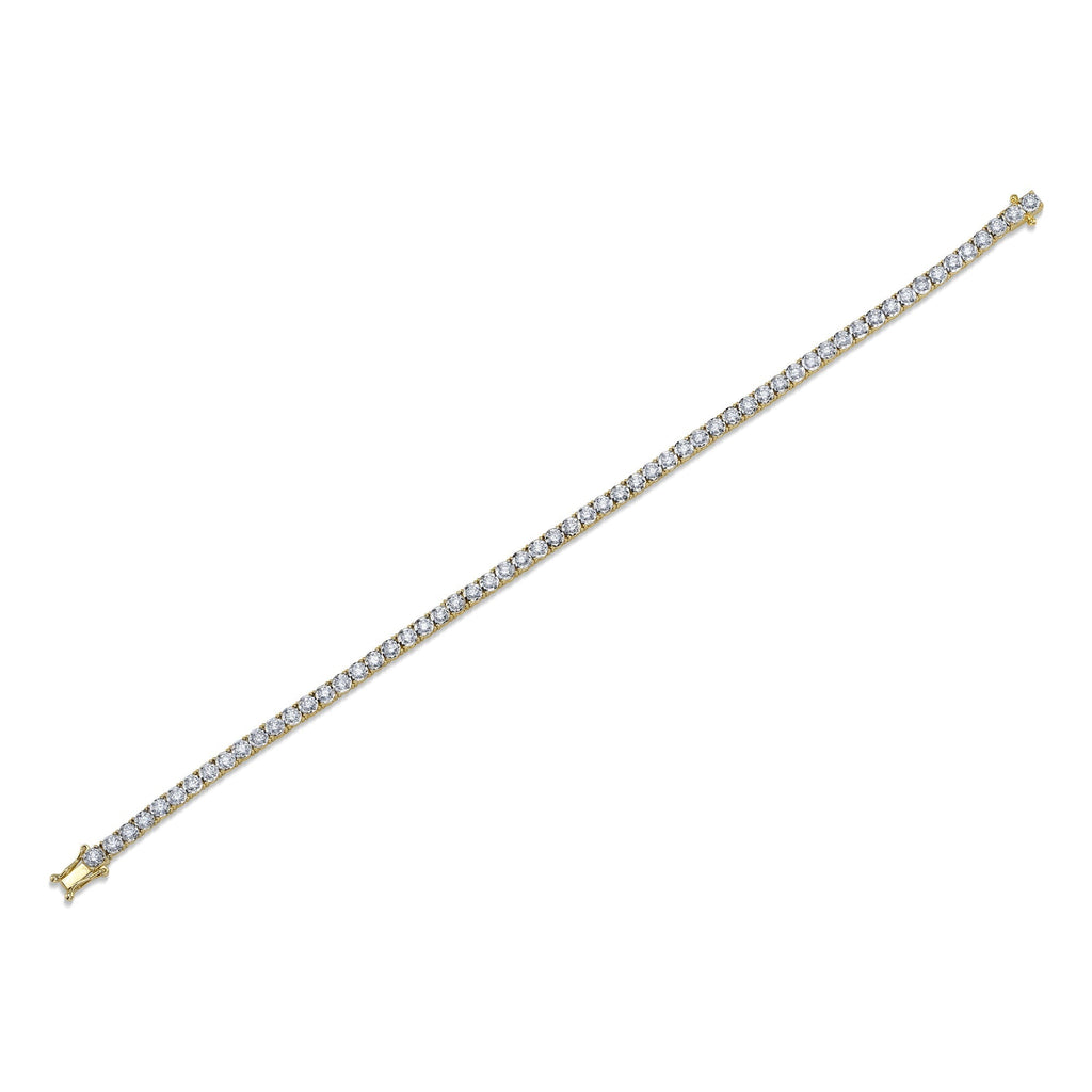 Yellow gold bracelet with round diamonds.