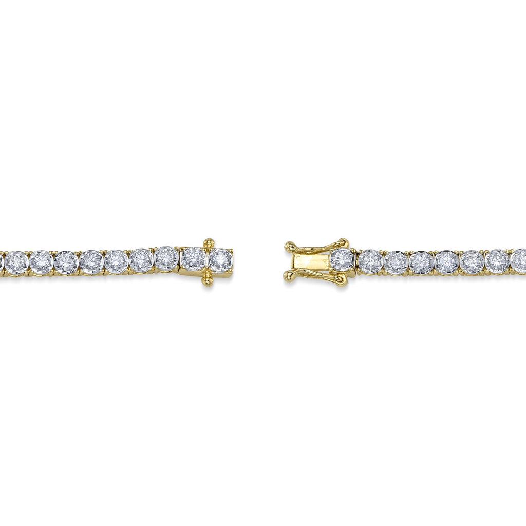 Yellow gold bracelet with round diamonds.