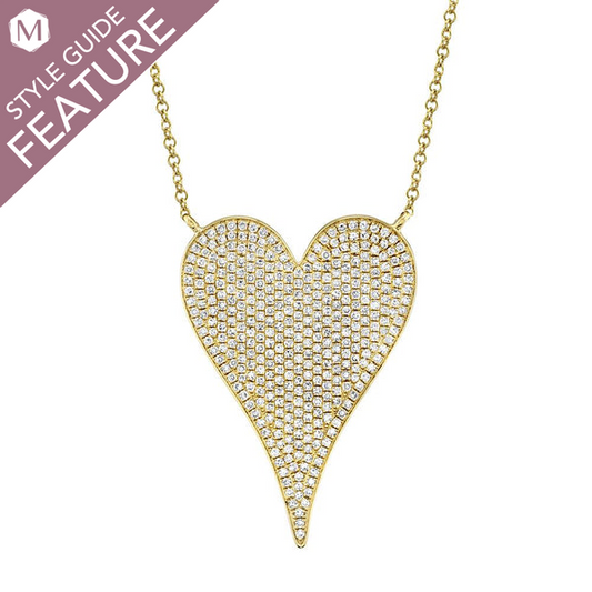 Heart-shaped diamond necklace with gold chain.