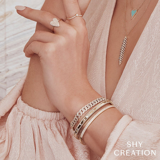 Yellow gold diamond ring with round stones.