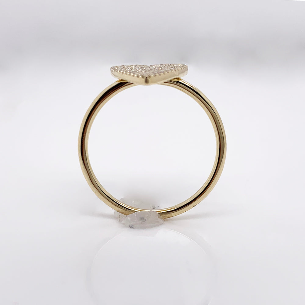 Yellow gold ring with heart-shaped diamond cluster.