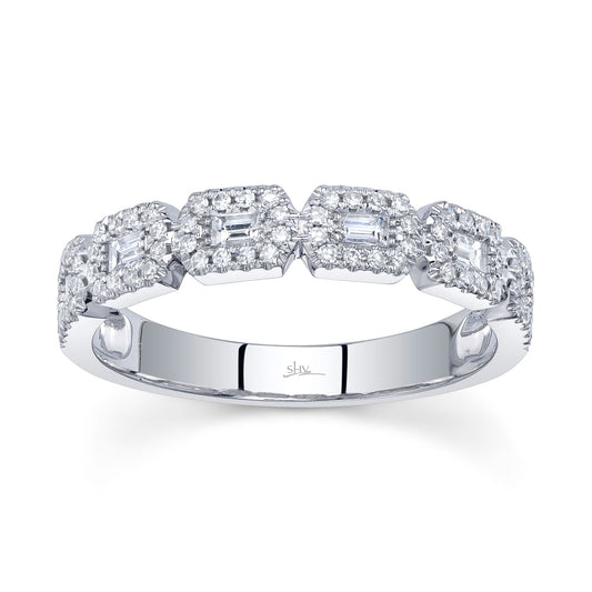 White gold band with geometric diamond shapes.