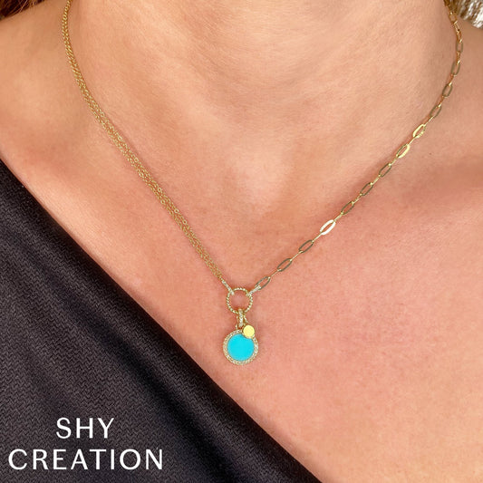 Turquoise circle necklace with diamonds.