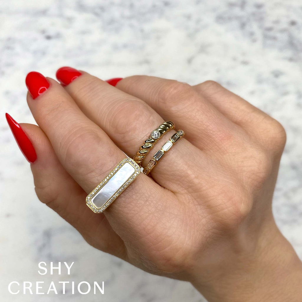Rectangular mother of pearl diamond ring.