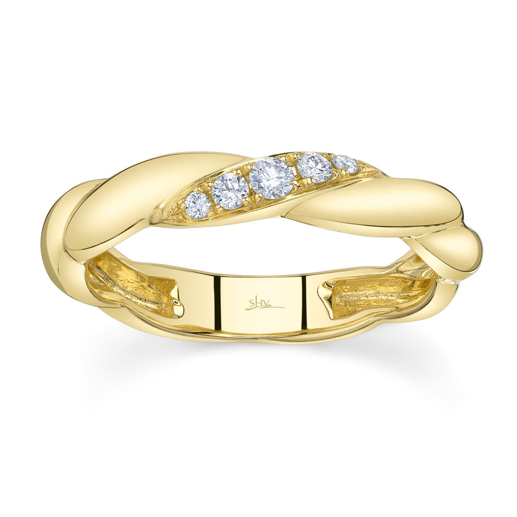 Twisted yellow gold band with diamonds.