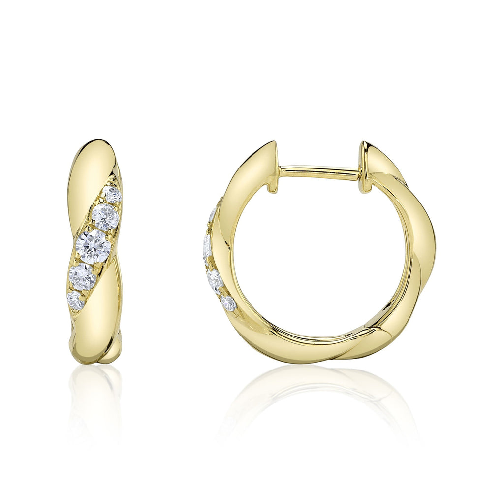 Huggie earrings with round diamonds in gold.